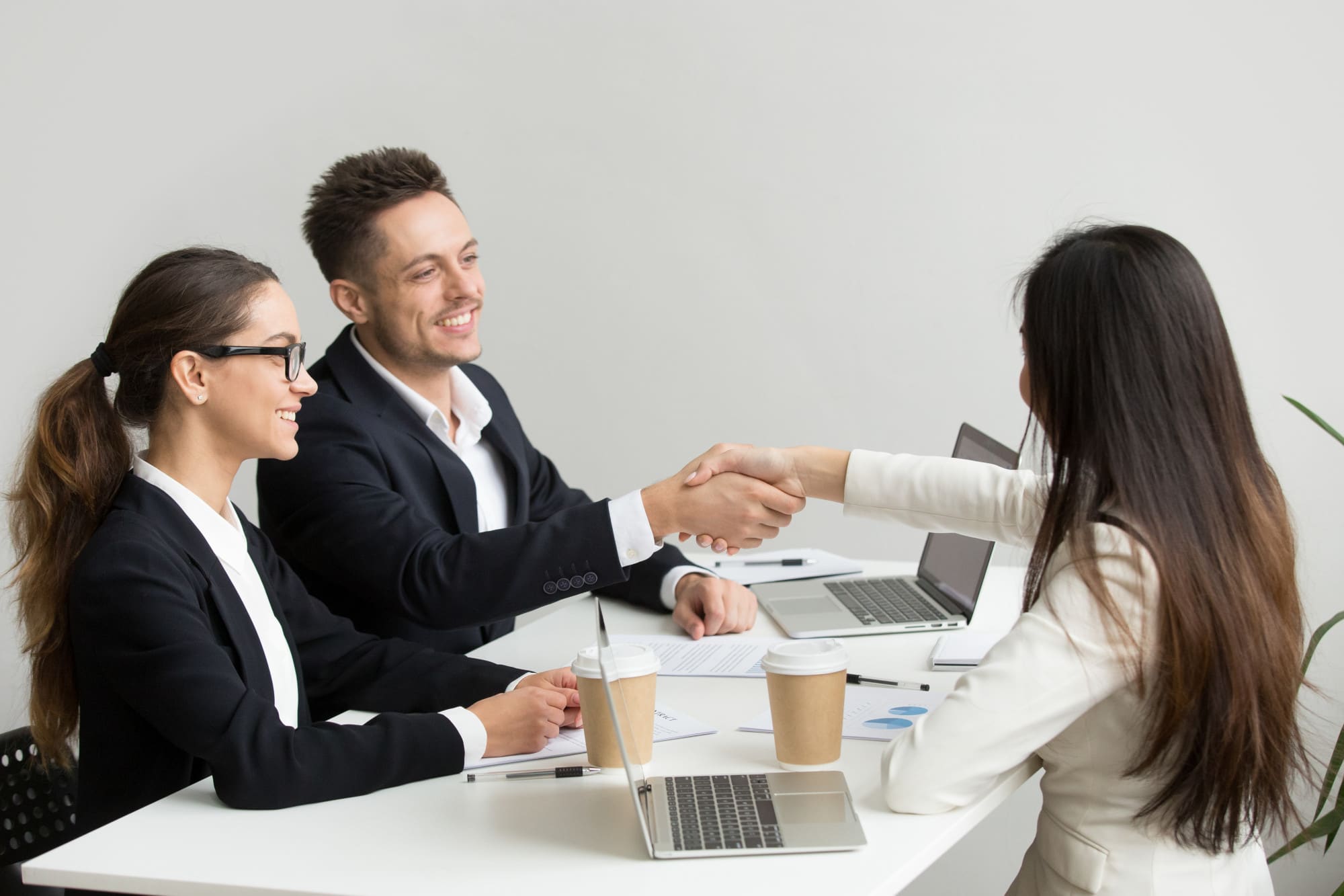 Colleagues shaking hands after a successful meeting